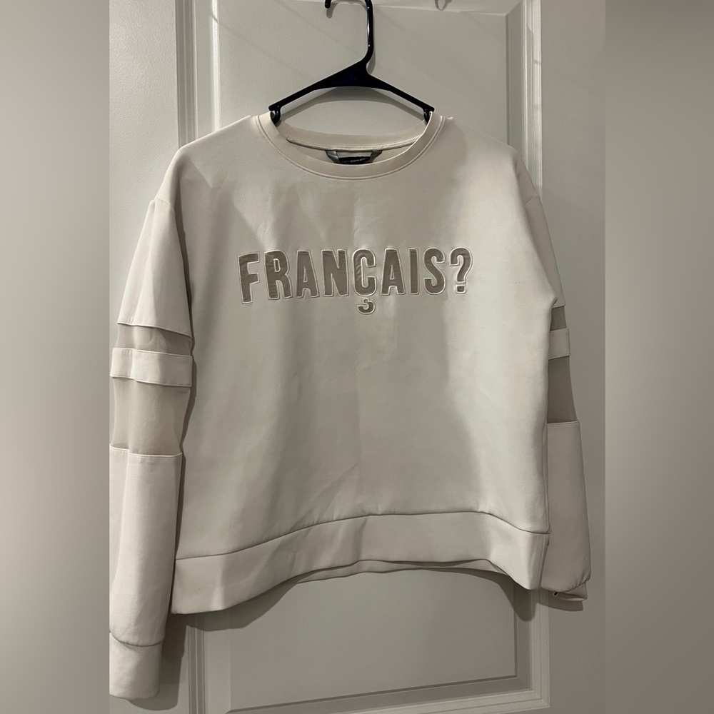 Chic Cream Sweater with French Text